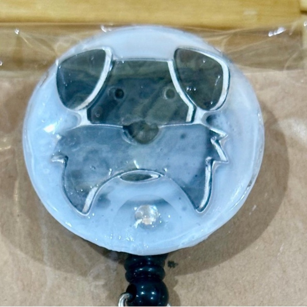 Terrier dog badge reel with belt clip